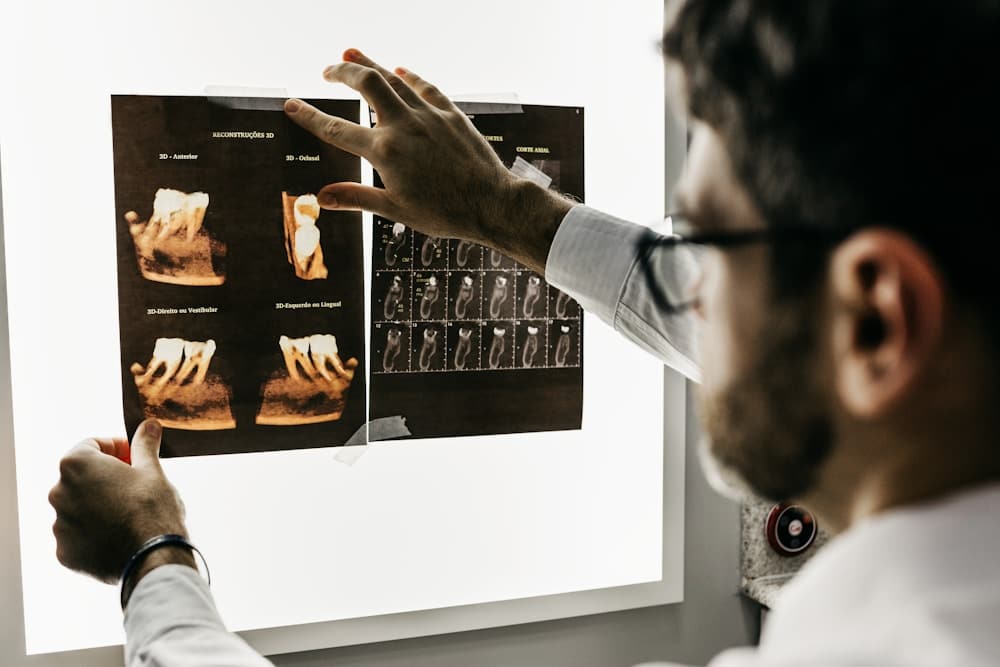 Dental lab technician working on a dental model