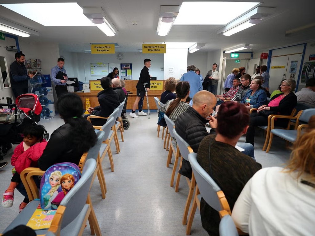 Patient seated and waiting for care in a clinic room